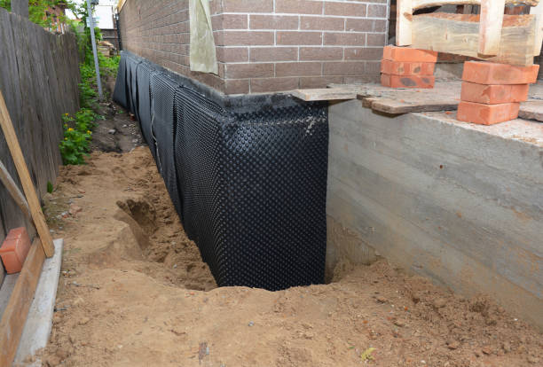 Happy homeowners after waterproofing job in Forest Junction